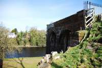 The remains of Tongland Viaduct on the Kirkcudbright Branch. There were stone piers in the river and the viaduct was of girder construction. The remains of the piers are in the field just beyond the arches in the picture. April 2010.<br><br>[John Gray 10/04/2010]