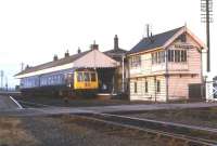 An afternoon train from New Holland Pier to Cleethorpes stands at NewHolland Town on 14 December 1974.<br><br>[Bill Jamieson 14/12/1974]