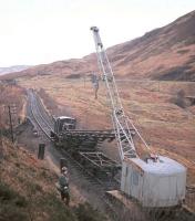 A young DS watches the track of the Callander & Oban line retreat slowly but steadily northwards at the northern end of Glen Ogle in December 1966.<br>
<br><br>[Frank Spaven Collection (Courtesy David Spaven) /12/1966]