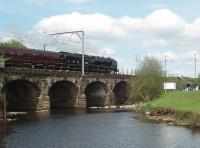 <I>The Black Duchess</I>, 6233, heads north over Six Arches bridge at Scorton on 8 May with a Gloucester to Carlisle excursion that she had taken over at Crewe.<br><br>[Mark Bartlett 08/05/2010]