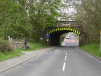 The narrow, low headroom, angled, rail overbridge with entrance to the down side of the former Haigh Station on the Wakefield to Barnsley line on the left. There is periodic impact damage or dislodging of arch stones by over-height vehicles here. M1 J38 is only some 50m behind the camera with through traffic accessing the motorway having increased considerably in recent years.<br><br>[David Pesterfield 08/05/2010]