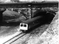 The <I>Rossendale Farewell</I> railtour negotiates the link between Knowsley St and Bolton St stations in Bury on its way to Rawtenstall. The area in the background that looks excavated is the trackbed of the old line to Bolton that dipped sharply at the west end of Knowsley St platforms to drop under the electric lines. The link reopened when East Lancashire Railway services were extended from Bury Bolton St to Heywood.<br><br>[Mark Bartlett 14/02/1981]