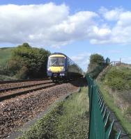 170 393 passes the site of the junction for Seafield Colliery with a southbound service on 15 May 2010 [see image 29016]<br><br>[David Panton 15/05/2010]