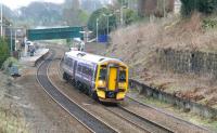 An Edinburgh - Dunblane service accelerates away from Polmont station on 23 April 2010. <br><br>[John Furnevel 23/04/2010]