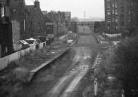 Remains of Merchiston station in 1972 looking east towards Dalry Junction. The trackbed now provides vehicle access to Slateford Yard behind the camera. [See image 11416]<br><br>[Bill Jamieson //1972]