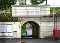 Passenger exit on the north side of Craigendoran station on 8 June 2010, looking across the line from the south (out of use) platform. Beyond the subway running below the West Highland line stand the houses of Dennistoun Crescent.<br><br>[John Furnevel 08/06/2010]