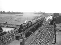 Black 5 no 44850 crosses the River Eden at Etterby in the summer of 1959 with a northbound parcels on the WCML. Meantime a light engine is held at signals on the 1942 bridge built to carry the goods lines, presumably on its way to Kingmoor shed.  <br><br>[Robin Barbour Collection (Courtesy Bruce McCartney) 04/07/1959]