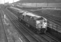 Class 26 no D5325 approaches Niddrie West Junction from Millerhill Yard in February 1970 with only a brake van in tow on what is probably an afternoon trip working within the Edinburgh area.<br>
<br><br>[Bill Jamieson 04/02/1970]