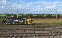 Freightliner Class 66 locomotives awaiting their next duties at Kingmoor on 3 July 2010. In the foreground is a snowplough which looks very much like a modified bogie from a Class 40, 44, 45 or 46 without the leading axle.<br>
<br><br>[John McIntyre 03/07/2010]