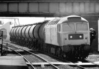 <I>'Oil be seeing you...' </I> crew change for a class 47 with a tank train at the south end of Rotherham Masborough station in May 1981. In the background an EE Type 4 waits for a path with another northbound freight. <br><br>[John Furnevel 04/05/1981]