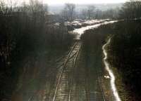 The closed and overgrown Spen Valley line at Cleckheaton looking south on 14 February 1997. The track has been truncated to make way for a car park extension to the Tesco supermarket in the left background.<br><br>[David Pesterfield 14/02/1997]