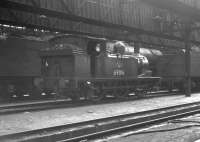 J72 0-6-0 no 69016 standing inside Heaton shed, thought to be on 11 April 1964.<br><br>[K A Gray 11/04/1964]