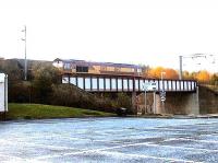 Westbound coal train passing through Wester Hailes station, 2002.<br><br>[John Furnevel //2002]