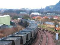 Westbound coal empties coming off the line from Millerhill yard at Niddrie West Junction on 21 February 2003 behind an unidentified EWS class 66 locomotive. <br><br>[John Furnevel 21/02/2003]