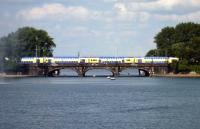 View across the Binnenalster, with one of the local <I>Metronom</I> services approaching Hamburg's main station on the afternoon of 27 July 2010.<br><br>[John Steven 27/07/2010]