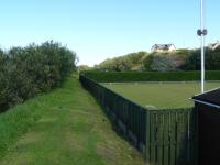 The site of Portgordon station, looking east towards Buckpool and Buckie, in August 2010. Half of the site is now occupied by the local bowling club. The line ran along the edge of the bowling green with the station building situated approximately at the far end of the green.<br><br>[John Williamson 05/08/2010]