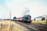 Fowler 4F 0-6-0 no 43922 takes a freight south on the approach to Symingon station on 29 August 1959, no doubt on its way home to Carlisle.<br><br>[A Snapper (Courtesy Bruce McCartney) 29/08/1959]