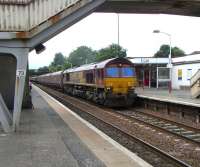 66 147 rumbles north through Cumbernauld with a train of hoppers on 14 Aug 2010.<br><br>[David Panton 14/08/2010]