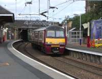 320 315 stands at the eastbound platform at Coatbridge Sunnyside with an Airdrie service.  In a few short months lucky Coatbridgers will be able to catch a regular service from that platform to Edinburgh (should that be their wish).<br><br>[David Panton 14/08/2010]