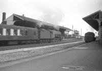 60073 <i>St Gatien</I> is too fast for the camera shutter at Tweedmouth on 12 August 1960 as the A3 runs through the station with the up <I>Queen of Scots</I> Pullman.<br><br>[Robin Barbour Collection (Courtesy Bruce McCartney) 12/08/1960]