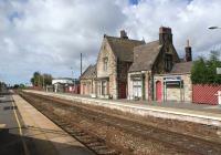 The old station building on the Wigan and Manchester bound platform at Burscough Bridge is no longer in railway use, although it still looks very much the part as it basks in the sunshine on 16 September 2010.<br>
<br><br>[John McIntyre 16/09/2010]