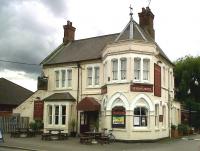The Station Hotel, unlike the station, is still engaged in its original business; and is still named after the station. The pub sign is nice - an almost exact copy of a Don Breckon painting - so it shows a GWR pannier tank on an LNWR line!<br><br>[Ken Strachan 27/08/2010]