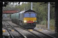 DRS 66420 passes Whifflet North Junction with an oil tank train, heading south. The 66 is thought to be on hire from DRS.<br><br>[Bill Roberton 27/09/2010]