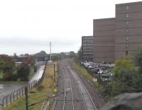 Standing on London Road in September 2010, looking down on where Bill Jamieson was looking up in 1972 [see image 27804]. St Margarets shed was to the right of the ECML on a site now occupied by dull government office blocks, one of which is currently empty. To the left of the line ran Clockmill Lane, at the far end of which was the entrance to Piershill station. The lane was obliterated for the construction of outbuildings for Meadowbank Stadium, opened for the Commonwealth Games, 40 years before the current games in Delhi. <br>
<br><br>[David Panton 29/09/2010]