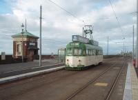Restored 1937 built Brush railcar 632, owned by the Lancastrian Transport Trust, is seen here operating in Blackpool again as part of the celebrations of the 125th aniversary of the tramway system. During its restoration it has been refitted with illuminated roof mounted advertising boxes, so much more attractive than the overall advertising liveries that have been a feature of recent years. The 73 year old tram is just about to reverse at Cabin and return to the Pleasure Beach and is seen here in the new platforms with the Cabin Lift behind. <br><br>[Mark Bartlett 16/10/2010]