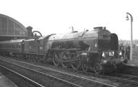 The RCTS <I>'Tyne - Solway Rail Tour'</I> hauled by A1 Pacific no 60131 <I>Osprey</I> takes water at Stockton on 21 March 1965 during a break in its journey from Leeds City to Carlisle via Newcastle.  <br><br>[K A Gray /03/1965]