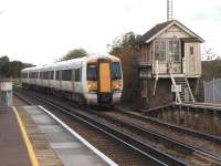 A Southeastern service from Ramsgate to London arrives at Wye between Canterbury and Ashford on 23 October 2010. The Signalbox is no longer in use although the level crossing at the south end of the platform is now worked from the station building.<br>
<br><br>[John McIntyre 23/10/2010]