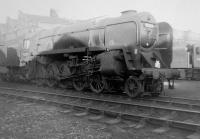 BR Standard class 9F 2-10-0 no 92214 in the shed yard at Woodford Halse (2F) in October 1963. This loco is now preserved, and, as of Oct 2014, is back at the Great Central Railway after being owned by a group of NYMR volunteers, from 2010-13. It is currently in lined green livery, similar to 92220 <I>Evening Star</I>.<br><br>[David Pesterfield 20/10/1963]