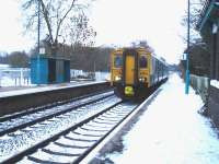 Standing in for the normal Class 153, and a long way from its usual South Wales haunts, Arriva Trains Wales 150264 was working the Crewe - Shrewsbury shuttle thoughout 30 November. It is seen approaching a deeply snow covered Yorton Station to form the 14.34 stopping service to Crewe<br><br>[David Pesterfield 30/11/2010]