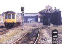 A DMU leaves Workington in May 1991. Despite the destination blind the train is heading south.<br><br>[Ian Dinmore /05/1991]