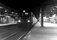 A night time passenger service calls at Osnabruck in 1976, hauled by 141 430-9.<br>
<br><br>[John McIntyre //1976]