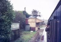 The rain soaked platform at Toller station on the Bridport Railway seen in August 1974. The station closed in May 1975 following which the wooden building was relocated to the South Devon Railway at Totnes. <br><br>[Ian Dinmore /08/1974]