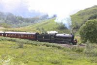 62005 starts the climb west from Glenfinnan station with <I>The Jacobite</I> on 26th June 2010. <br><br>[Colin Miller 26/06/2010]