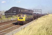 Brush Type 4 D1795 has just passed Bowesfield signal box, standing at the eastern apex of the triangle of lines to the west of Tees Yard and south of Stockton. The train is a Teesport to Jarrow block oil working, photographed in October 1970. <br>
<br><br>[Bill Jamieson 02/10/1970]