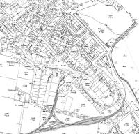 An extract from the 1921 map of Campbeltown showing the light railway now extended from the 1899 route [See image 33448] through a cutting and onto the town's quayside over reclaimed land. A triangular junction has also been created near the railway depot. By this time the passenger service had been operating for around fifteen years but within ten years from this date would cease following which the railway was dismantled. <br><br>[Mark Bartlett ../../1921]
