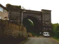 If you need a house with a large external storage area, try Central Street in Ener'glyn, on the North side of Caerphilly. This dramatic arch, which dwarfs the 17-seat minibus below, is all that remains of the Barry Railway viaduct. The BR was known to staff of rival companies as 'the spoilt child of Parliament' - like the GCR, it arrived last and closed first, surviving for only 40-odd years during the peak of coal production in the Rhondda. So this viaduct was used for 45 years, but has been derelict for 73. Sad. The Valley line to Caerphilly passes to the left of this arch; there is a plan to build a new station here. <br><br>[Ken Strachan 31/05/2010]
