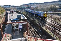 A northbound sprinter passes the Muirhouse Central Junctions on the Glasgow Central approach lines of 1879. This is the view from the steps up to Albert Drive.<br><br>[Ewan Crawford 27/03/2011]