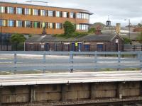 The remaining building from the former goods yard alongside Wakefield Westgate Station, seen here on 5 April 2011. [See image 33629]. It was demolished in 2013 when the new station main building was being built on the cleared area seen in the foreground, that continues to the multi-storey car park erected to left of view.<br><br>[David Pesterfield 05/04/2011]