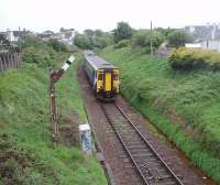 The first down train of the day is almost on the sea wall as it drops down the link line from Stranraer Town station to the Harbour on 25 May 2011. 156506 will, after a 40 minute layover in the quayside station, head back north on the 2 1/2 hour run to Glasgow. <br><br>[Mark Bartlett 25/05/2011]