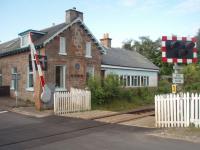 The former Dalcross station, between Inverness and Nairn, viewed from the north side of the level crossing in July 2011. The station closed in 1965 and like a number of others on this line is now a private residence. If a new station opens for Inverness Airport as proposed it will be sited to the east of here.<br><br>[Mark Bartlett 01/07/2011]