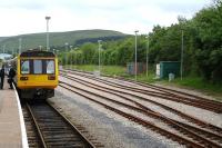 142073 and a sister unit wait at the platform at Rhymney prior to returning south with the 17.29 service to Penarth on the afternoon of 8 June 2011. The refurbished stabling sidings and run round loop stand on the right. <br><br>[David Pesterfield 08/06/2011]