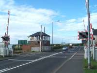 Newsham South level crossing and signal box on the Blyth & Tyne, looking west towards Cramlington on 19 July 2011. Newsham station, which stood less than half a mile to the north, lost its passenger service in November 1964.<br><br>[Colin Alexander 19/07/2011]