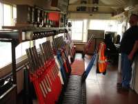 Looking along the interior of Tondu signal box in September 2011, where most levers are still in operation to support four lines radiating from Tondu, including the rarely used line from Margam and that to Ogmore Vale and Pontycymer. Levers have been pulled for the incoming 15.46 service from Bridgend to Maesteg.<br><br>[David Pesterfield 14/09/2011]