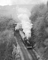 On its first outing after restoration from Barry scrapyard condition, preserved ex S&DJR 2-8-0 No. 13809 passes New Mills Central station with the <I>Pines Express</I> excursion of 2nd May 1981. The train, which had originated in Leicester, was powered by 13809 from Guide Bridge to York and then back to Sheffield. Just in front of  the locomotive is the turnout for the Hayfield branch, the stub of which was retained as a turnback siding for terminating local trains from Manchester Piccadilly.<br><br>[Bill Jamieson 02/05/1981]