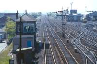View west at Haymarket Central Junction in the spring of 1971, as seen from the bridge carrying the closed CR Granton branch over the NB main line. The 'Sub' curves off sharply to the left not far beyond the signal box. Locomotives of classes 25, 27 and 40 can be seen on Haymarket shed.<br><br>[Bill Jamieson //1971]