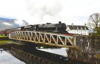 Black 5 no 44871 eases slowly across the swing bridge at Banavie with <I>The Jacobite</I> on 13 October 2011.<br>
<br><br>[John Gray 13/10/2011]